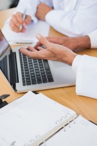 Close up on interrogative doctors hands in bright office